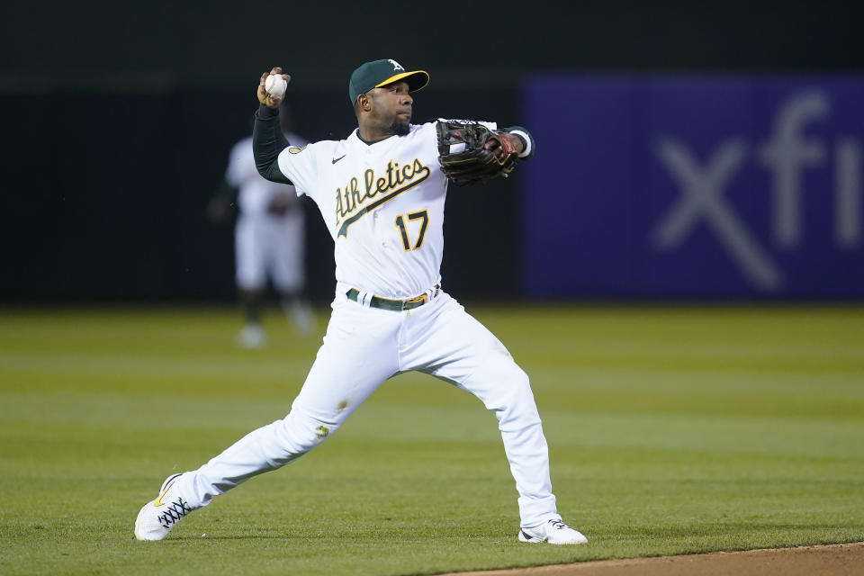 Oakland Athletics shortstop Elvis Andrus throws out Minnesota Twins' Gio Urshela at first base during the seventh inning of a baseball game in Oakland, Calif., Monday, May 16, 2022. (AP Photo/Jeff Chiu)