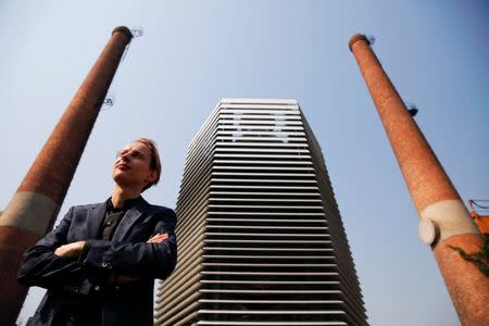 Dutch artist and innovator Daan Roosegaarde poses in front of the Smog Free Tower, the world's largest smog vacuum cleaner as he presents his The Smog Free Project at D-751 art zone in Beijing September 29, 2016. REUTERS/Damir Sagol