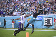Jacksonville Jaguars wide receiver Marvin Jones Jr. (11) makes a touchdown catch against Baltimore Ravens cornerback Marcus Peters (24) during the second half of an NFL football game, Sunday, Nov. 27, 2022, in Jacksonville, Fla. (AP Photo/Phelan M. Ebenhack)