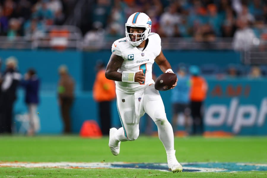 MIAMI GARDENS, FLORIDA – JANUARY 07: Tua Tagovailoa #1 of the Miami Dolphins carries the ball against the Buffalo Bills during the first half of the game at Hard Rock Stadium on January 07, 2024 in Miami Gardens, Florida. (Photo by Megan Briggs/Getty Images)