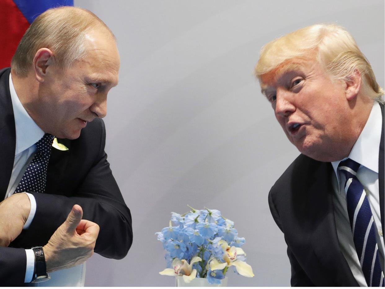 Donald Trump and Vladimir Putin met at the G20 summit in Hamburg, Germany July 2017. Overall more countries trust the Russian leader in world affairs: MIKHAIL KLIMENTIEV/AFP/Getty Images