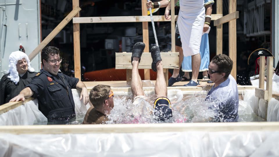 Members of HMCS Ottawa conduct a Crossing the Line ceremony after sailing over the equator on 24 October 2023. - Aviator Gregory Cole/Canadian Armed Forces Photo