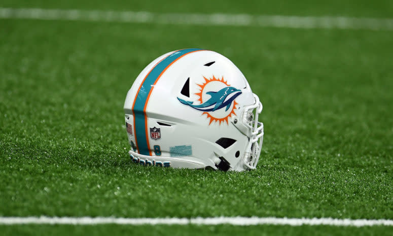 Miami Dolphins helmet sits on the turf.