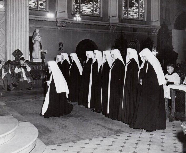 Young women wait to take their final vows as Dominican nuns during a 1947 ceremony at St. Bernard Catholic Church in Akron.