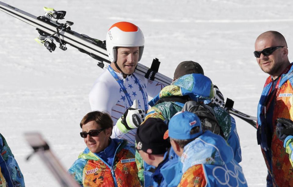 United States' Bode Miller talks to Olympic staff after a men's downhill training run for the Sochi 2014 Winter Olympics, Saturday, Feb. 8, 2014, in Krasnaya Polyana, Russia. the 2014 Winter Olympics, Saturday, Feb. 8, 2014, in Krasnaya Polyana, Russia. (AP Photo/Christophe Ena)