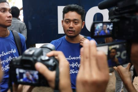 FILE PHOTO: Youth activist Maung Saung Kha talks to the press at Insein court in Yangon