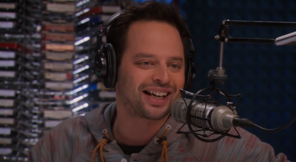 Nick Kroll wearing headphones on Parks and Recreation.