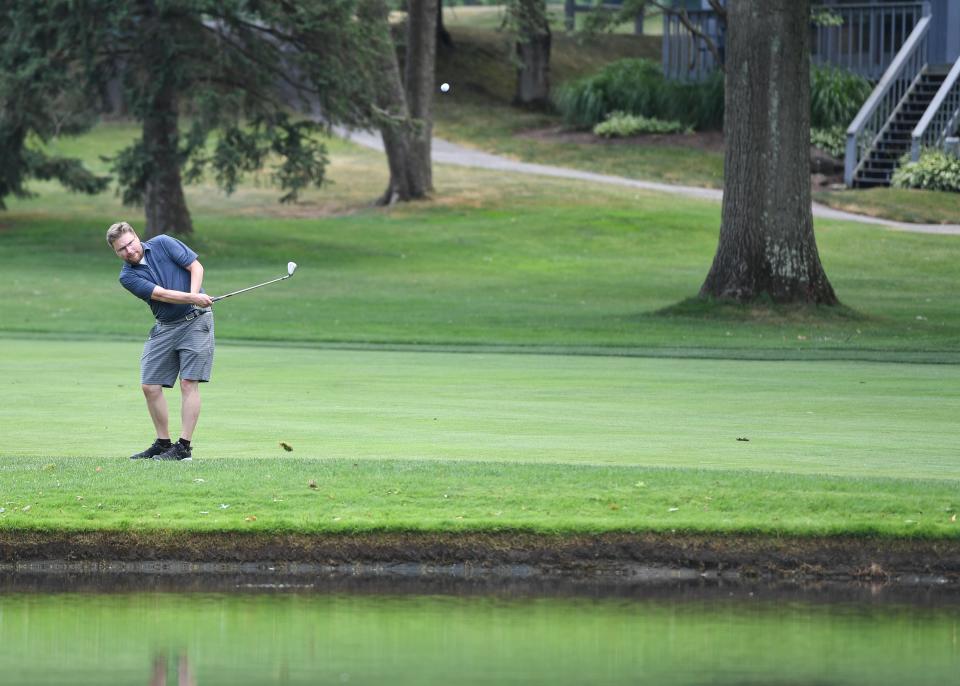 Ryan Lewis of the Akron Beacon Journal plays the 16th hole of Firestone Golf Club’s South Course, nicknamed “The Monster,” on Monday in Akron.