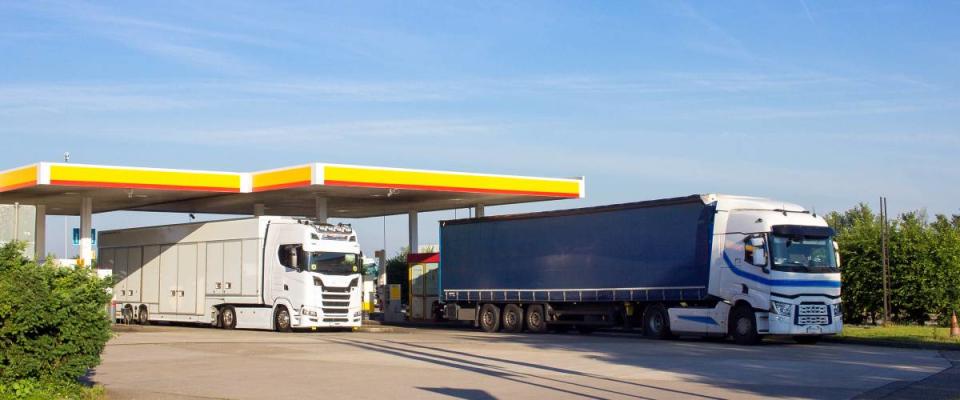 Trucks parked in gas station lot