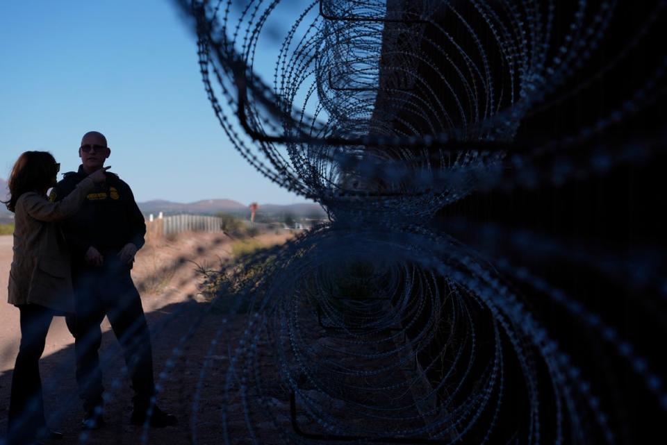 Democratic presidential nominee Vice President Kamala Harris talks with John Modlin, the chief patrol agent for the Tucson Sector of the U.S. Border Patrol, right, as she visits the U.S. border with Mexico in Douglas, Ariz., Friday, Sept. 27, 2024 (AP)