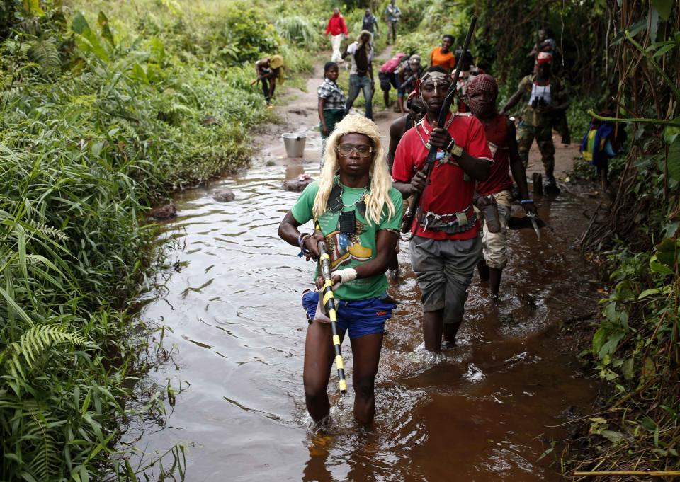 Members of anti-balaka, a Christian militia, patrol outside the village of Zawa