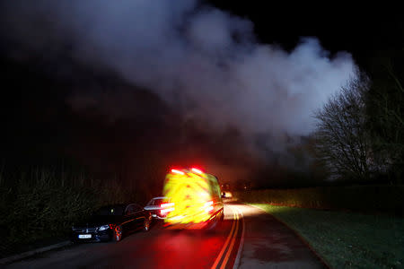 Emergency vehicles are seen following a large fire inside the George Bryan Centre at the Robert Peel Hospital in Tamworth, Britain, February 11, 2019. REUTERS/Eddie Keogh