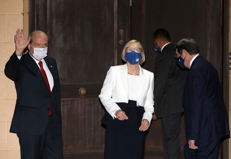 FILE PHOTO: Turkish Cypriot leader Ersin Tatar waves next to Elizabeth Spehar, U.N. Special Representative of the Secretary-General and Head of UNFICYP Mission and Cypriot President Nicos Anastasiades and in the buffer zone of Nicosia airport