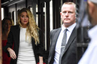 Amber Heard arrives at High Court, in London, Monday, July 27, 2020. Hollywood actor Johnny Depp is suing News Group Newspapers over a story about his former wife Amber Heard, published in The Sun in 2018 which branded him a 'wife beater', a claim he denies. (AP Photo/Alberto Pezzali)