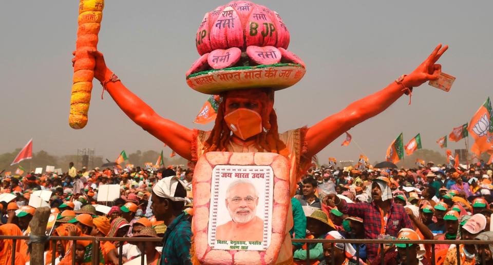 A Bharatiya Janata Party supporter dressed as lord Hanuman, gestures during a mass rally addressed by Prime Minster Narendra Modi ahead of the state legislative assembly elections at the Brigade Parade ground in Kolkata on March 7, 2021. Photo: DIBYANGSHU SARKAR/AFP via Getty Images