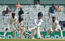 Cricket - India v England - Fifth Test cricket match - M A Chidambaram Stadium, Chennai, India - 20/12/16. England's Keaton Jennings plays a shot as India's players look on. REUTERS/Danish Siddiqui