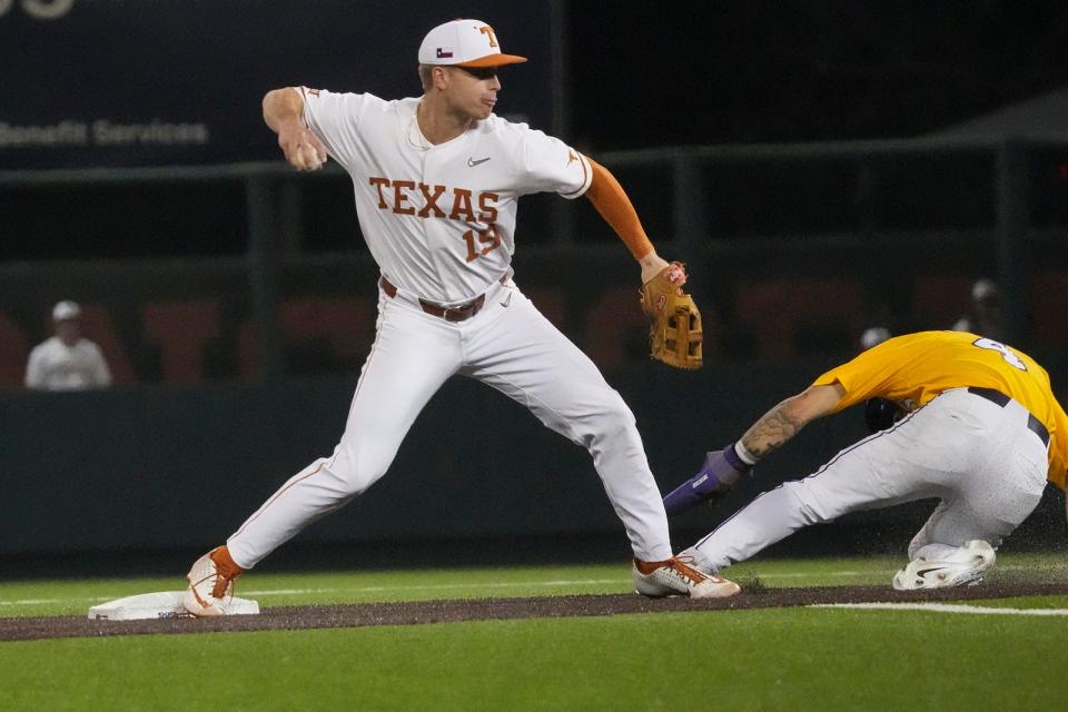 Texas infielder Mitchell Daly throws to second base after tagging out LSU's Jordan Thompson during Tuesday night's 3-0 loss to the No. 1 Tigers. Texas, which is 3-5 on the season, plays at Cal State Fullerton this weekend.