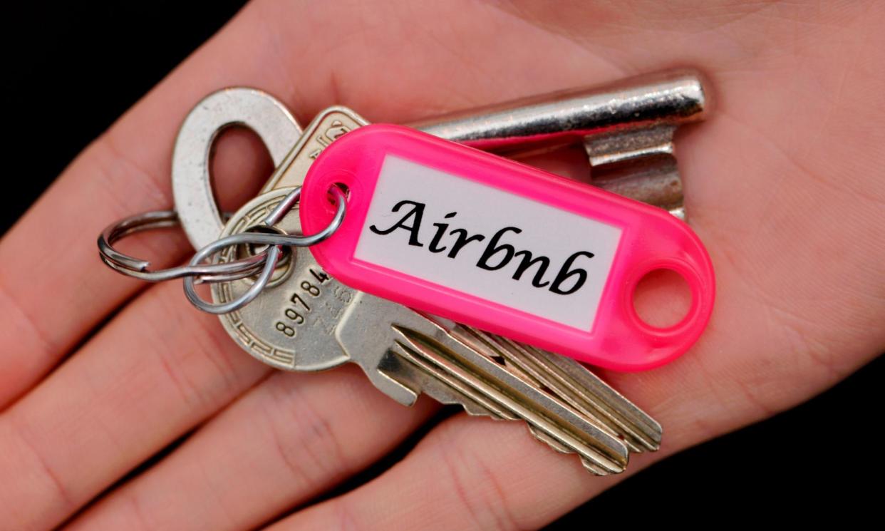 <span>Handing over the keys to Airbnb of a rented house by a tenant who isn’t paying rent.</span><span>Photograph: Imagebroker/Alamy</span>