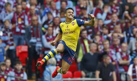 Alexis Sanchez celebrates after scoring the second goal for Arsenal. Action Images via Reuters / Carl Recine