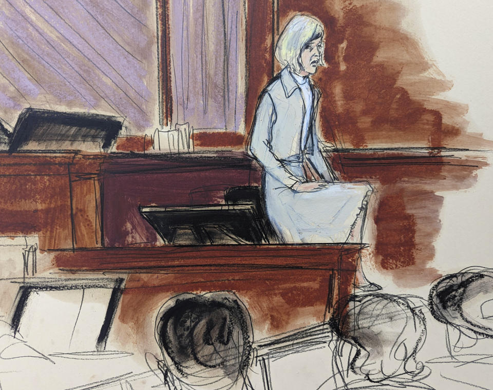 In this courtroom sketch, in Federal Court, in New York, Thursday, April 27, 2023, E. Jean Carroll stands with one leg up to show the jury how she was able to push Donald Trump off of her during the alleged assault, and escape from the dressing room in 1996. (AP Photo/Elizabeth Williams)