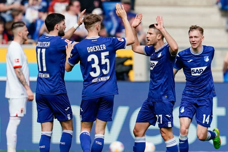 Hoffenheim Andrej Kramaric (2nd R) celebrates scoring his side's second goal with teammates during the German Bundesliga soccer match between TSG 1899 Hoffenheim and FC Augsburg at the PreZero Arena. Uwe Anspach/dpa