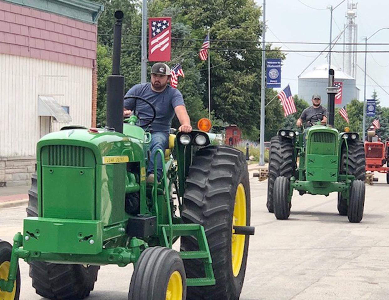 Drivers take off from Sibley on their annual Sibley Burr Oaks Tractor Drive over the weekend.