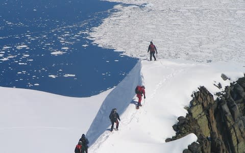 people on snowy hillside