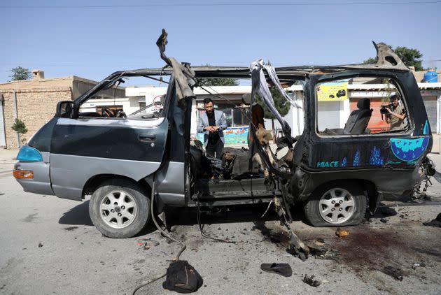 Afghan journalists film the site of a bomb explosion in Kabul, June 3, 2021. No one took responsibility for the attack, which took place in a neighborhood largely populated by the minority Hazara ethnic group. (Photo: Rahmat Gul via Associated Press)