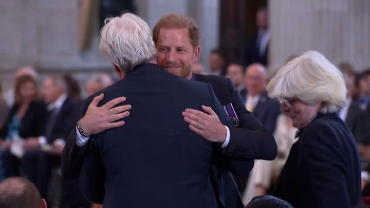 Prince Harry hugs family as he is supported by Princess Diana’s brother and sister at Invictus Games ceremony. (UK POOL)