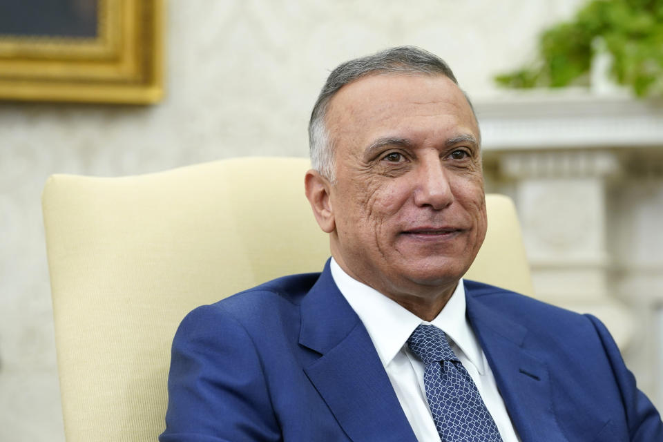 Iraqi Prime Minister Mustafa al-Kadhimi listens during his meeting with President Joe Biden in the Oval Office of the White House in Washington, Monday, July 26, 2021. (AP Photo/Susan Walsh)