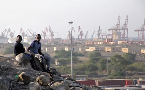 Poverty stricken neighbourhood, of Balbala overlooking rapid development and Doraleh container port in Djibouti - Credit: Susan Schulman