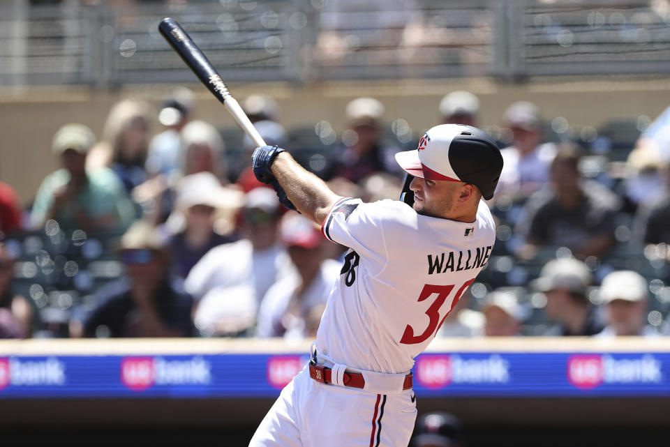 Minnesota Twins' Matt Wallner hits a home run during the fourth inning of a baseball game against the Seattle Mariners, Wednesday, July 26, 2023, in Minneapolis. (AP Photo/Stacy Bengs)