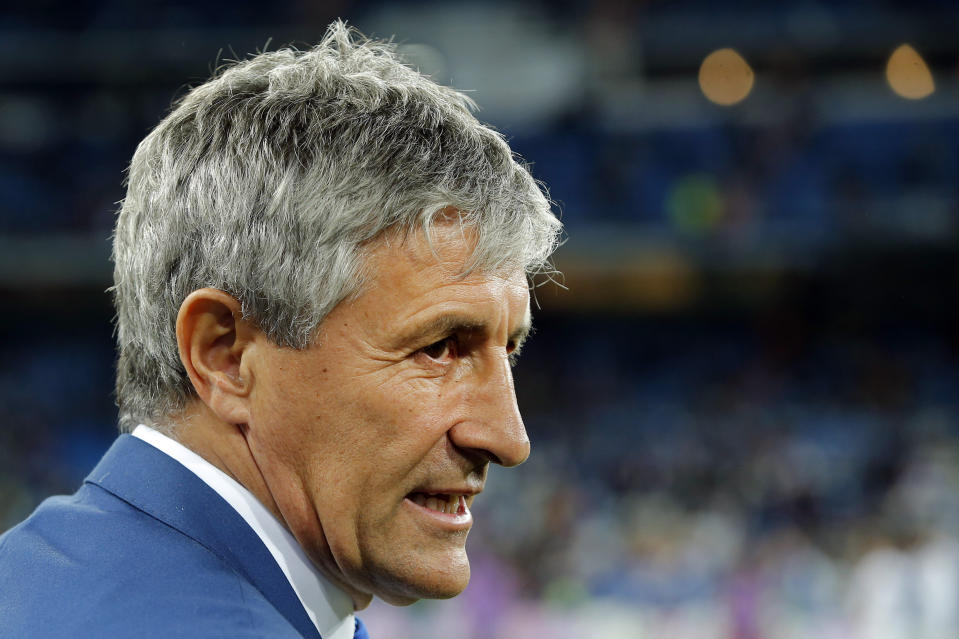 FILE _ In this Wednesday, March 1, 2017 file photo, Las Palmas coach Quique Setien waits for the start of a Spanish La Liga soccer match between Real Madrid and Las Palmas at the Santiago Bernabeu stadium in Madrid, Spain. The Spanish league only has four games remaining, but there are some coaches who may not make it that far. Real Betis manager Quique Setien and Girona’s Eusebio Sacristan are under pressure after losing streaks, while Alaves coach Abelardo Fernandez has had a falling out with his club over his future. (AP Photo/Paul White, File)
