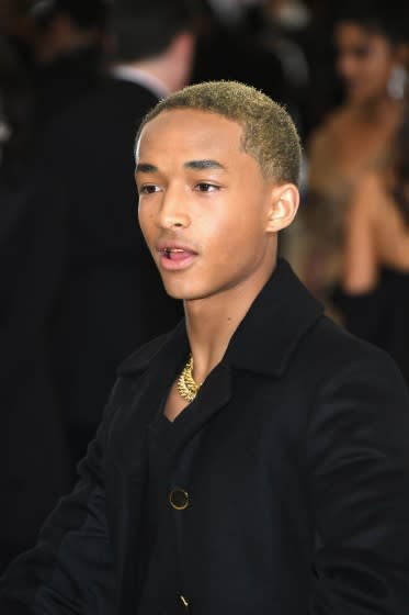 Jaden Smith with cut hair in hand at 2017 MET Gala