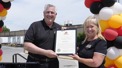 Mark Heird, President of DAP, accepts certificate from Melanie L. Koorey, Senior Business Development Representative, Regional Growth & Retention, Department of Commerce