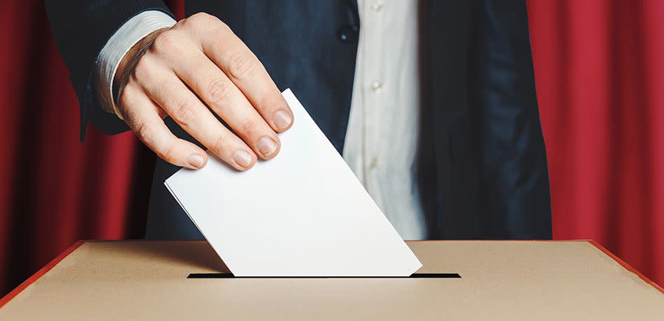 Man Voter Putting Ballot Into Voting box.