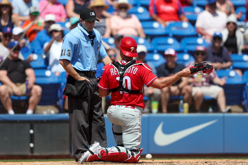 Mar 27, 2023;  Dunedin, Florida, USA;  Philadelphia Phillies catcher JT Realmuto (10) is ejected by umpire Randy Rosenberg (113) against the Toronto Blue Jays in the fourth inning during spring training at TD Ballpark.  Mandatory Credit: Nathan Ray Seebeck-USA TODAY Sports