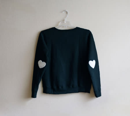 <div class="caption-credit"> Photo by: Jay Vee Boutique</div><b>Chic Heart Elbow Sweater <br></b> Wear your heart on your sleeve... literally! I adore this chic black sweater with little white hearts on the elbows. You could definitely get away with wearing this one year round. <br> <i><a href="http://www.disneybaby.com/blog/wear-your-heart-on-your-sleeve-20-adorable-handmade-heart-accessories/#slide9" rel="nofollow noopener" target="_blank" data-ylk="slk:Get it here;elm:context_link;itc:0;sec:content-canvas" class="link ">Get it here</a></i> <br>