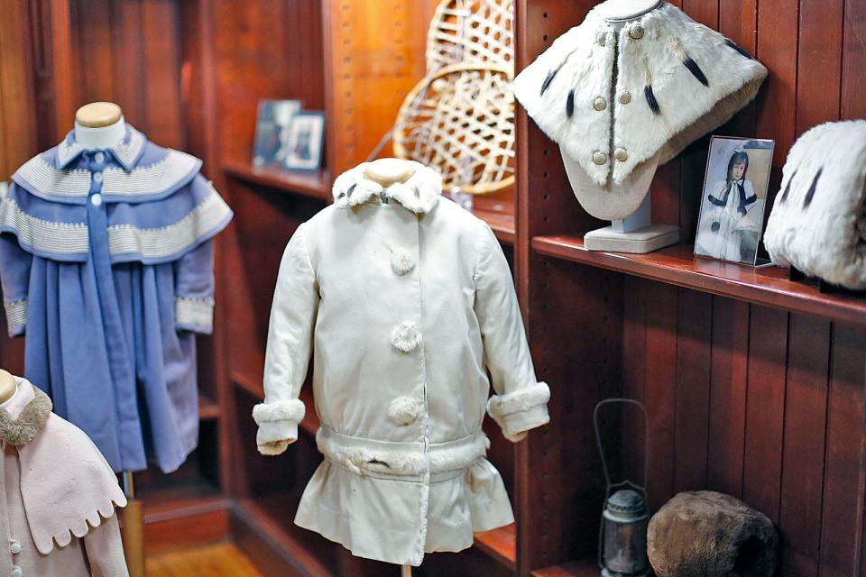 This cream-colored wool child's coat with a dropped waistline has ermine trim. It was worn by Jessie and Jane Bancroft, who were born in 1908 and 1912, and is part of the exhibit "Baby, It's Cold Outside" at the Cohasset Historical Society. Wednesday, Jan. 17, 2024.