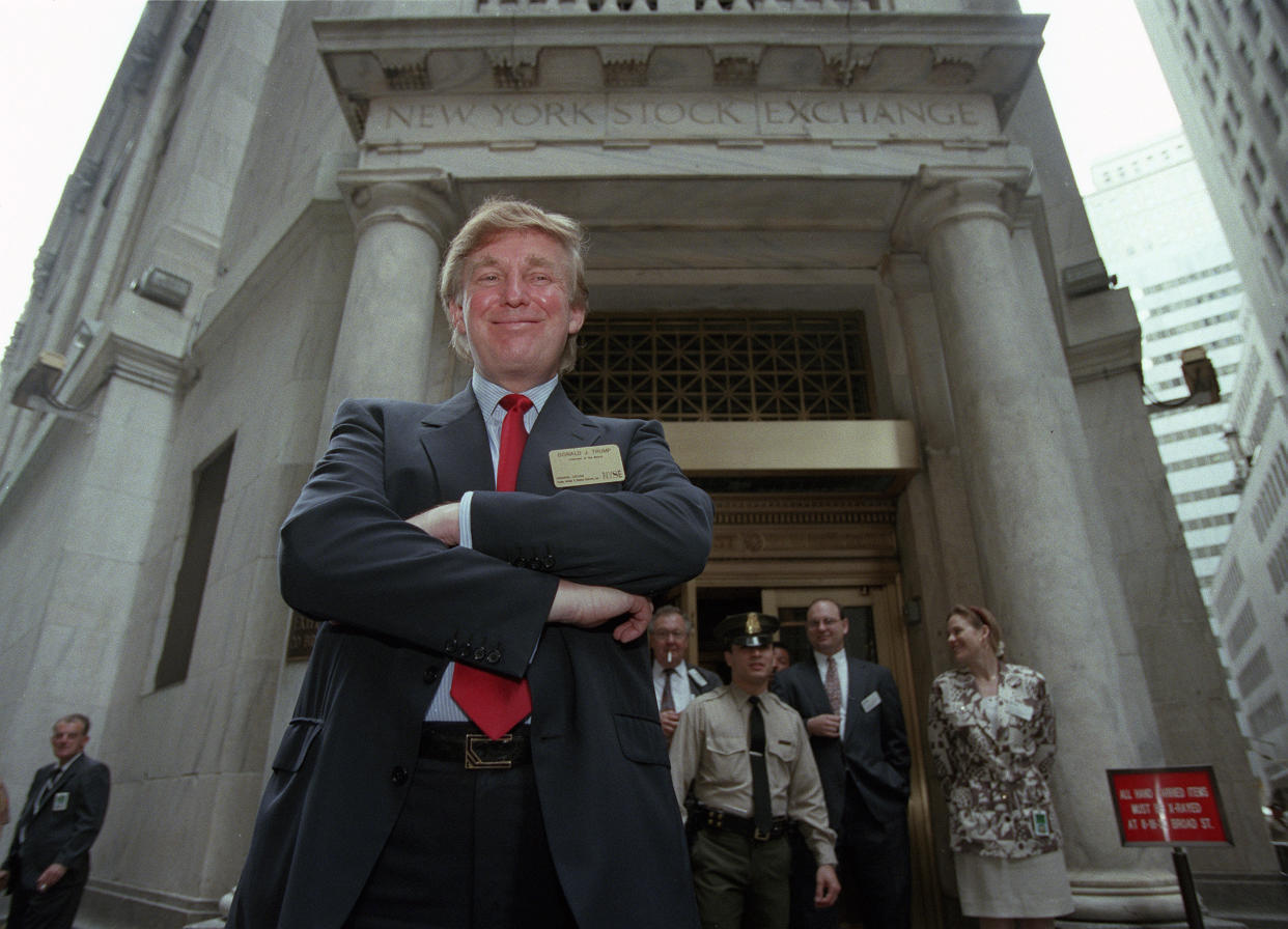 FILE - Developer Donald Trump poses for photos outside the New York Stock Exchange after the listing of his stock on Wednesday, June 7, 1995, in New York. He took his flagship Trump Plaza Casino public, offering 10 million shares of common stock at an estimated price of $14 per share. (AP Photo/Kathy Willens, File)