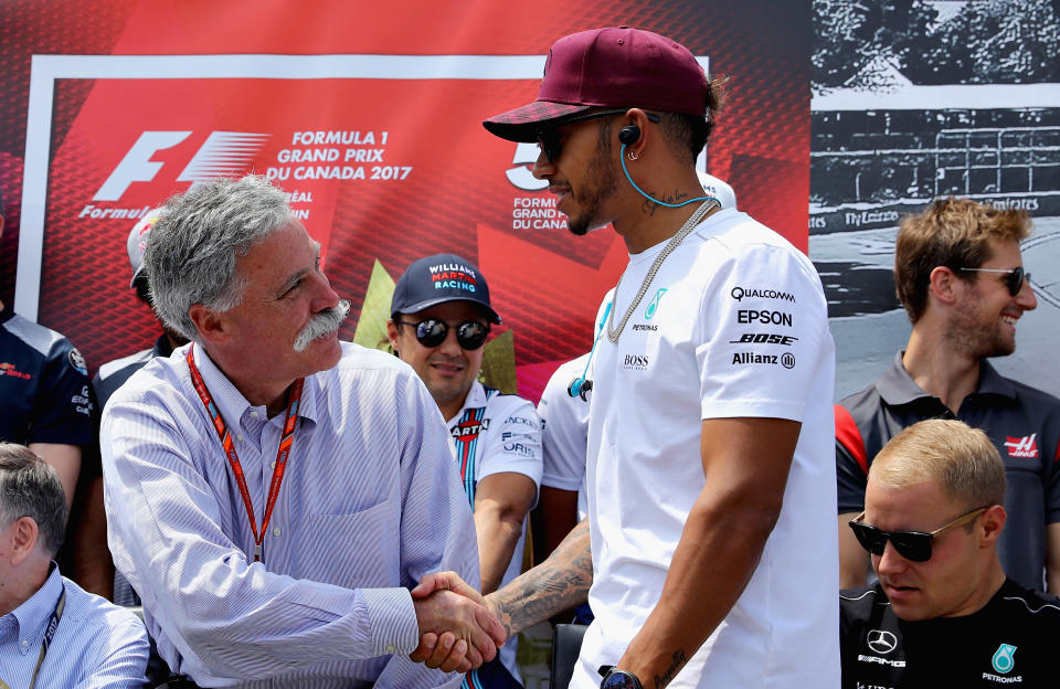 MONTREAL, QC - JUNE 11: Chase Carey, CEO and Executive Chairman of the Formula One Group shakes hands with Lewis Hamilton of Great Britain and Mercedes GP before the Canadian Formula One Grand Prix at Circuit Gilles Villeneuve on June 11, 2017 in Montreal, Canada.  (Photo by Clive Mason/Getty Images)