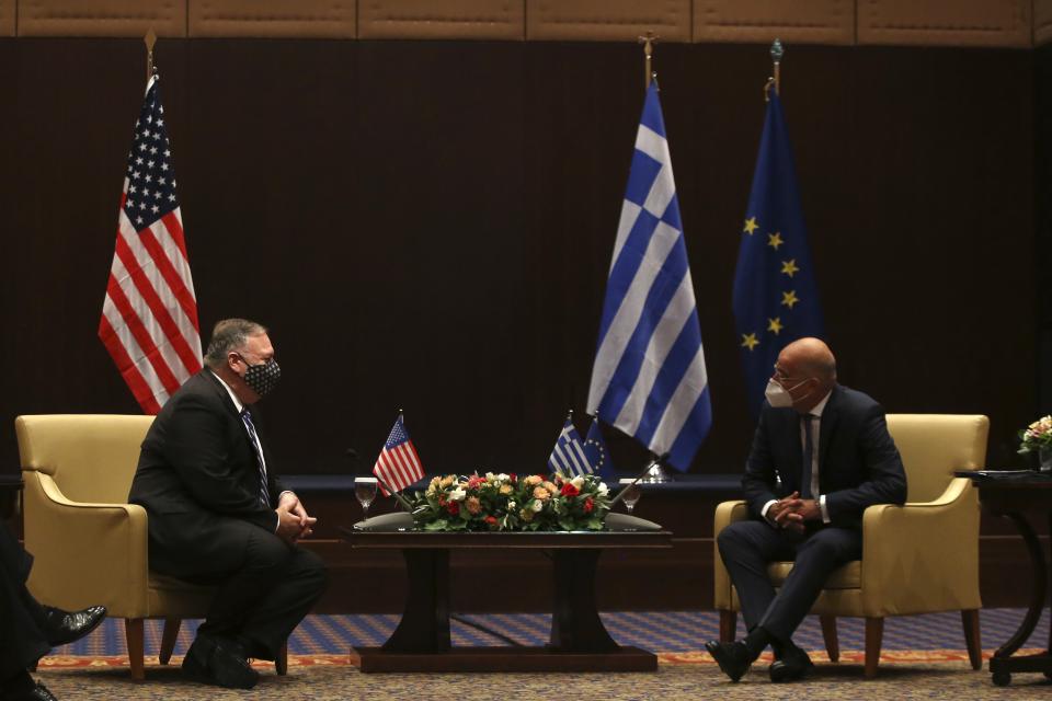 U.S. Secretary of State Mike Pompeo, left, and Greek Foreign Minister Nikos Dendias speak during their meeting in the northern city of Thessaloniki, Greece, Monday, Sept. 28, 2020. Pompeo and Dendias, will sign a bilateral science and technology agreement, as well as host energy sector business leaders for a discussion to highlight energy diversification and infrastructure projects in Greece. (AP Photo/Giannis Papanikos, Pool)