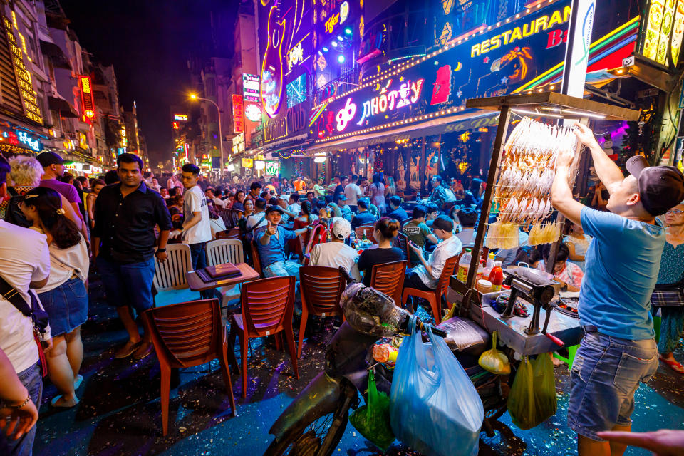 Ho Chi Minh City, Saigon, Vietnam - December 31, 2019: The Backpacker Street of Ho Chi Minh City with crowds of People at New Year evening