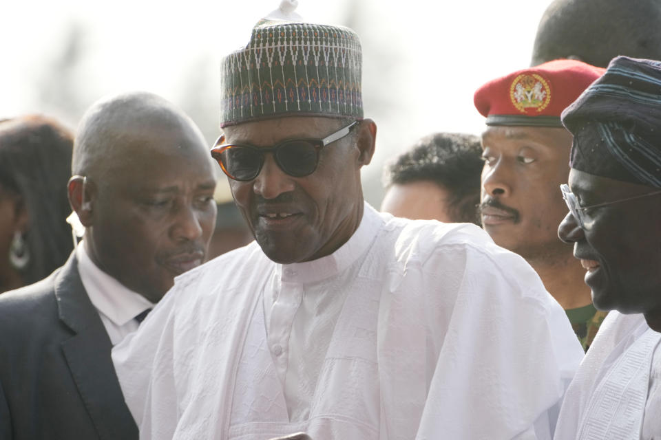 Nigeria's President, Muhammadu Buhari, center, arrived to Commission the Lekki deep seaport in Lagos, Nigeria, Monday, Jan. 23, 2023. Nigeria's President Muhammadu Buhari on Monday commissioned a Chinese-built and -funded $1.5 billion deep seaport in the commercial hub of Lagos with authorities optimistic the project would help grow the West African nation's ailing economy. (AP Photo/Sunday Alamba)