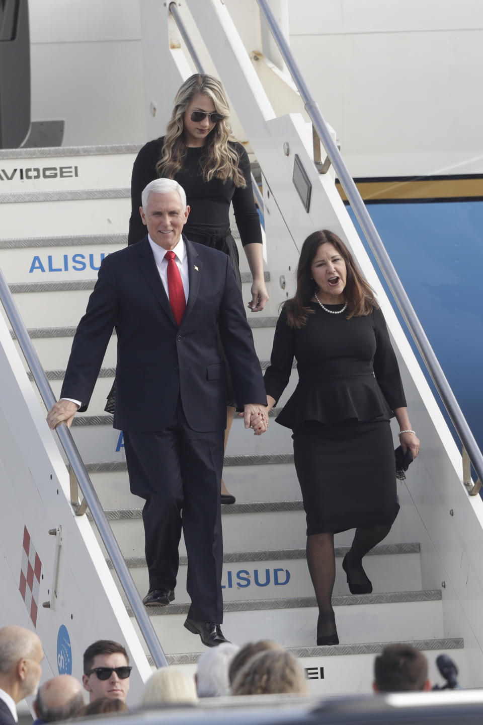 U.S. Vice President Mike Pence and his wife Karen hold hands as they disembark from Air Force Two upon their arrival at Rome's Ciampino airport, Friday, Jan. 24, 2020. Pence is scheduled to meet later with Pope Francis at the Vatican. (AP Photo/Gregorio Borgia)