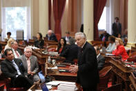 State Sen. Jim Nielsen, R-Gerber, standing center, explains his reasons for not voting against the 2019-2020 state budget in Sacramento, Calif., Thursday, June 13, 2019. Both houses of the Legislature approved the $214.8 billion state budget that spends more on health care and education, bolsters the state's top firefighting agency and boost state reserves.(AP Photo/Rich Pedroncelli)