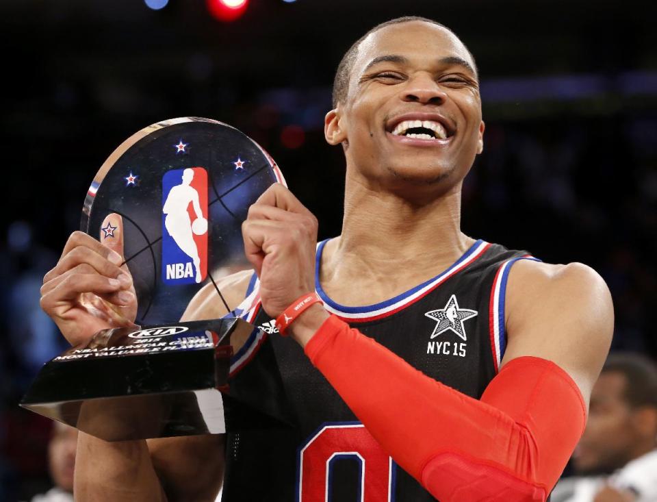 West Team’s Russell Westbrook, of the Oklahoma City Thunder, holds the MVP trophy after the NBA All-Star basketball game, Sunday, Feb. 15, 2015, in New York. The West Team won 163-158. (AP Photo/Kathy Willens)
