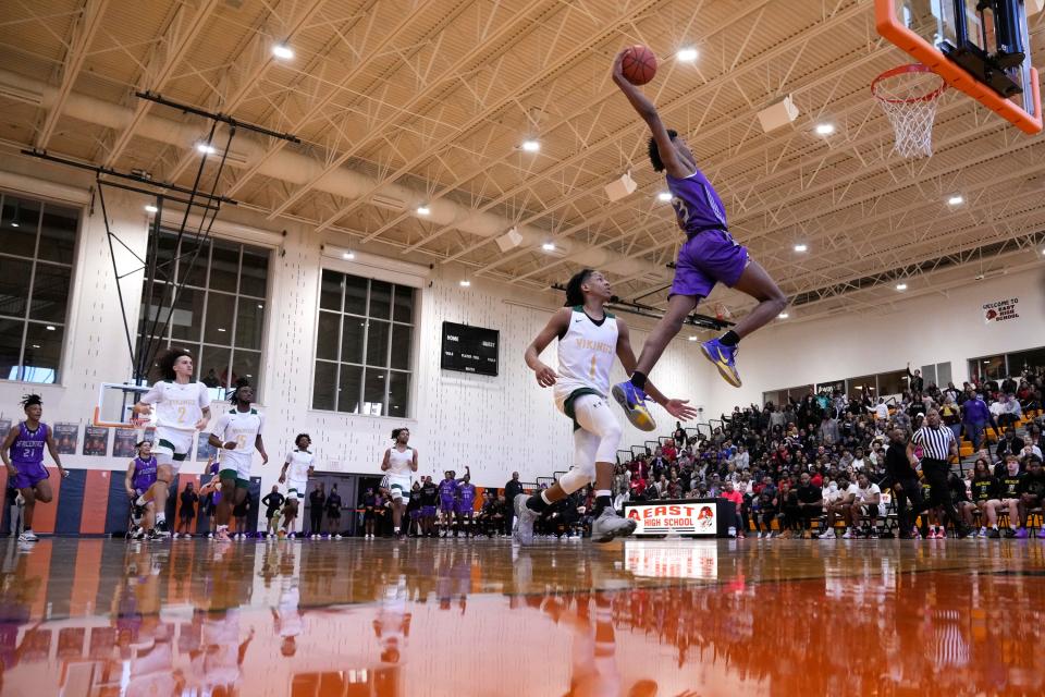 Feb 11, 2023; Columbus, Ohio, United States;  Africentric's Dailyn Swain (3) slam dunks while defended by Northland's King Kendrick (1) during the second quarter of the Columbus City League boys basketball championship between Africentric and Northland at East High School on Saturday afternoon. Mandatory Credit: Joseph Scheller-The Columbus Dispatch