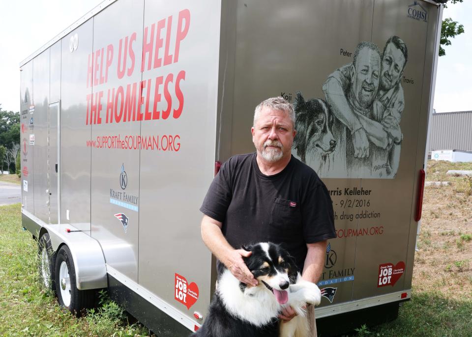 Peter Kelleher, the Massachusetts-based “Soupman,” with his dog Koji, outside the Support the Soupman warehouse at 1 Bert Drive in West Bridgewater, on Tuesday, Aug. 2, 2022.