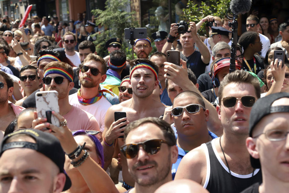 Crowds participate in Stonewall Day honoring the 50th anniversary of the Stonewall riots, hosted by Pride Live and iHeartMedia, in Greenwich Village on Friday, June 28, 2019, in New York. (Photo by Greg Allen/Invision/AP)